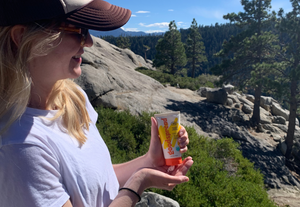 Woman hiking with goodspread mineral sunscreen.