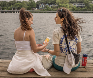 Person applying Goodspread reef-safe mineral sunscreen outdoors